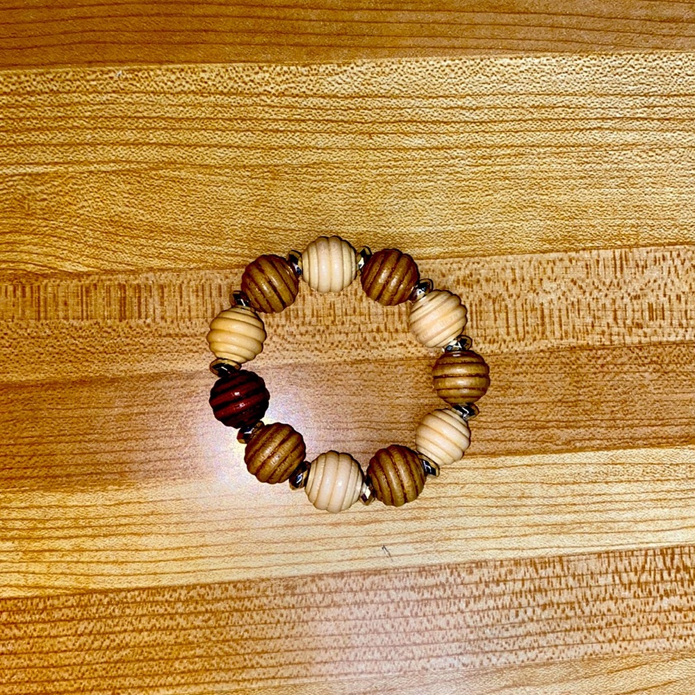 Handmade stretch bracelet wooden beads with silvertone beads.